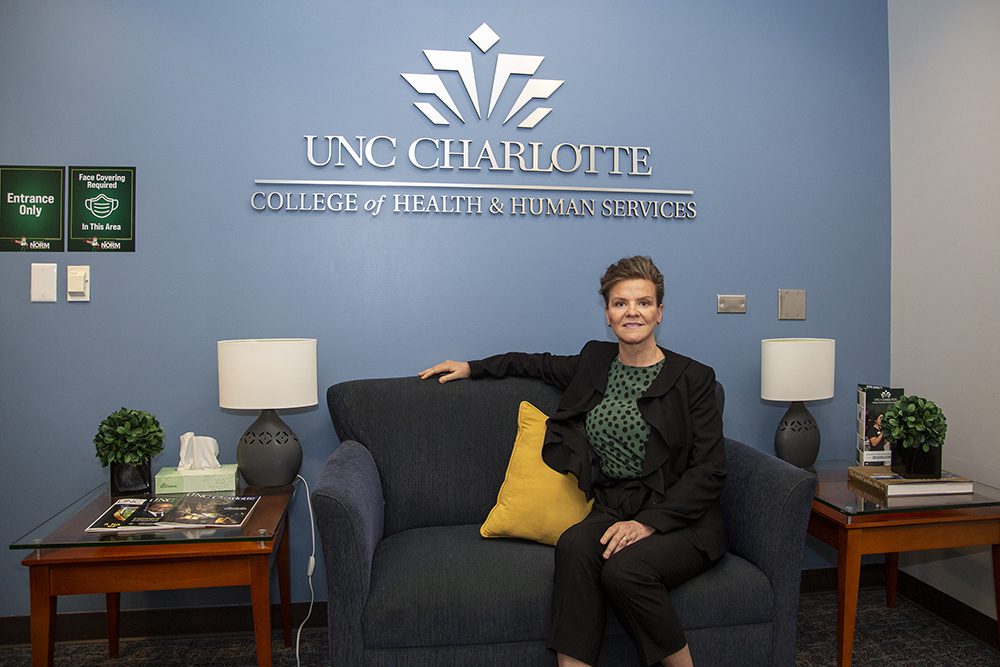 Dean Jennifer Troyer in front of the Niblock Student Center