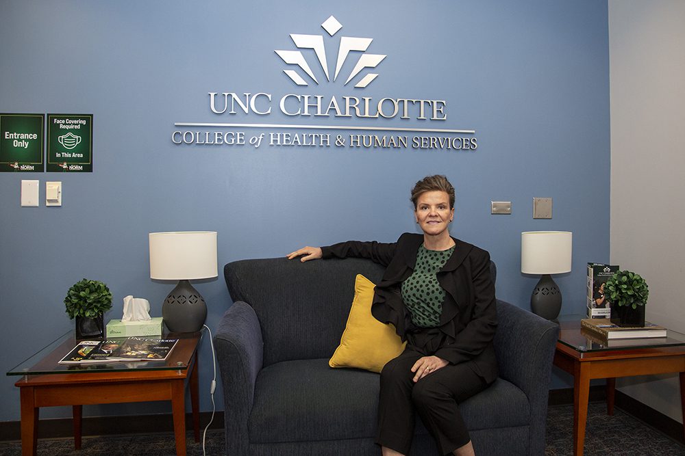 Dean Jennifer Troyer in front of the Niblock Student Center